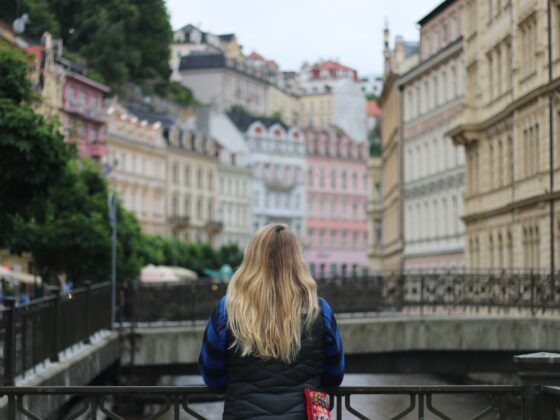 A girl looks out over Karlovy Vary, a small Czech town