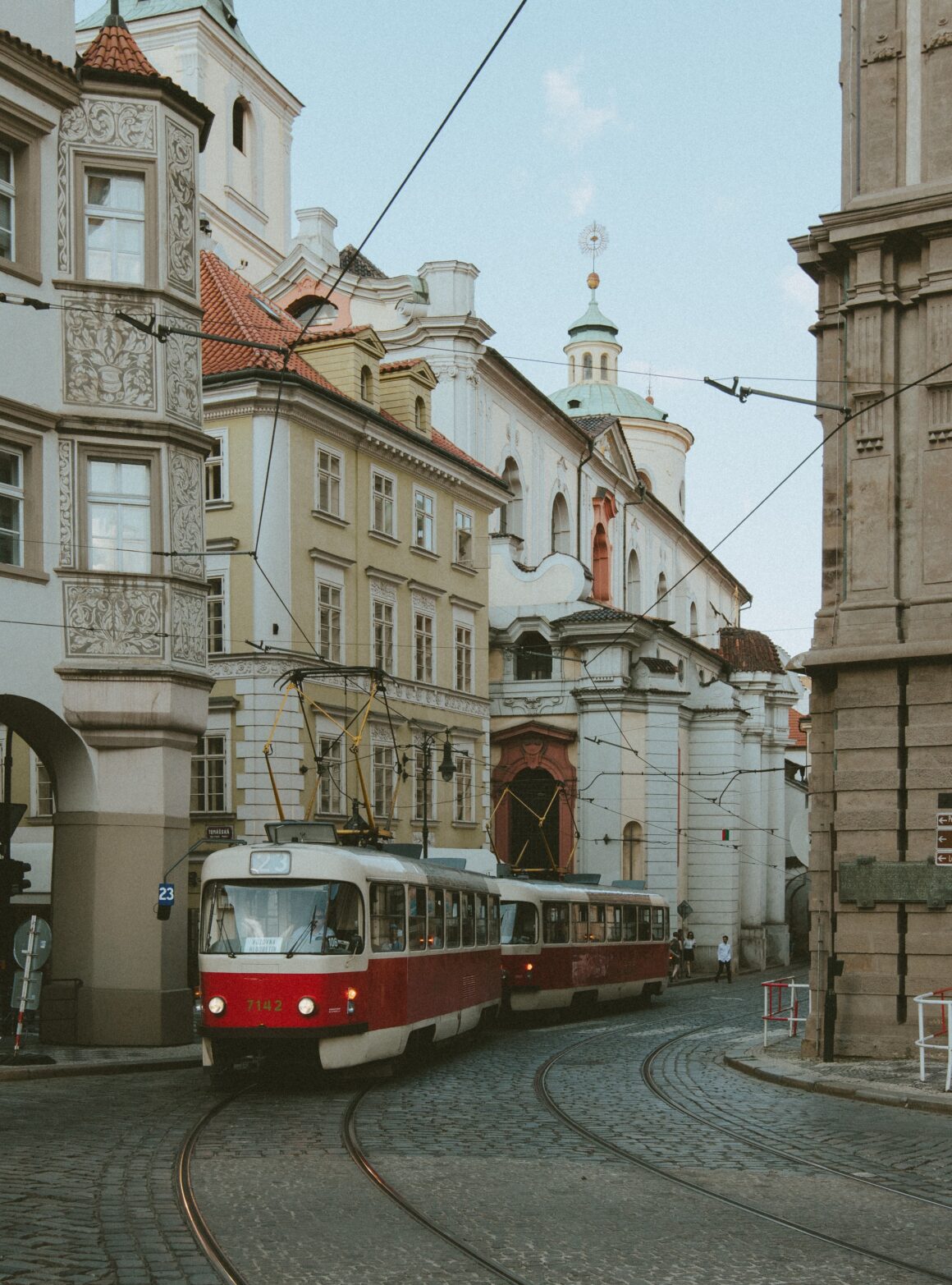 A tram goes through Prague's historical streets