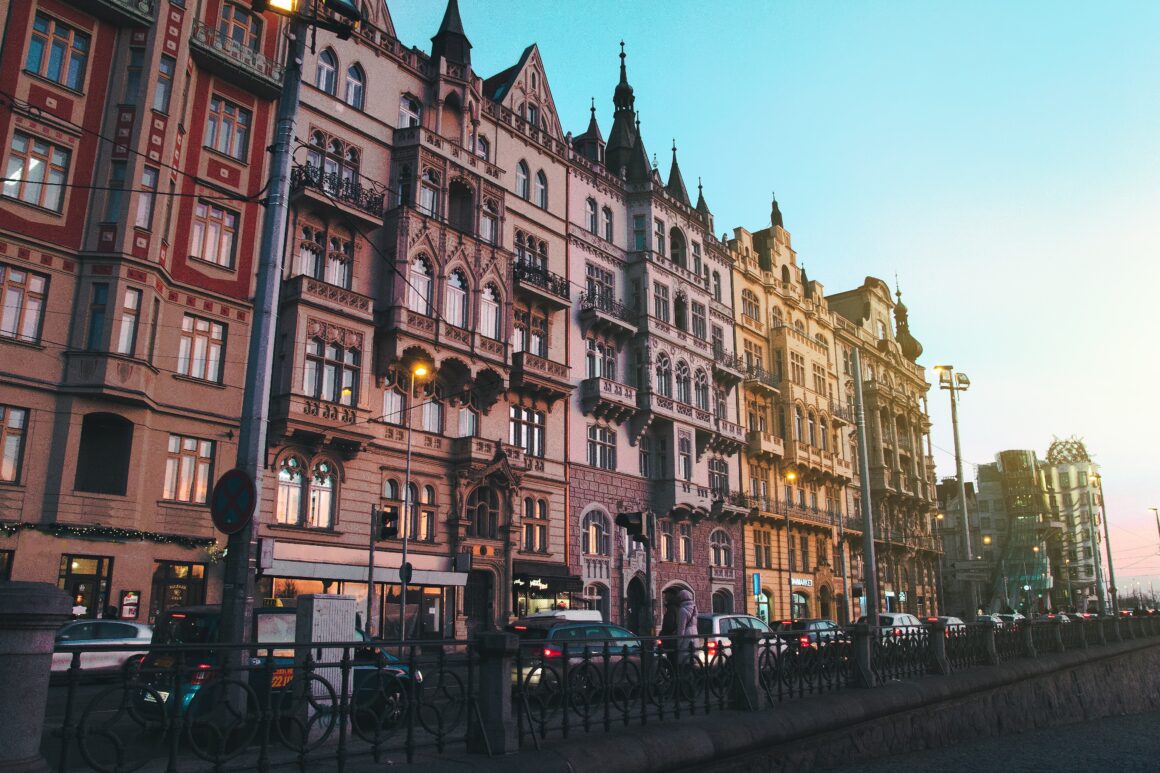 Vehicles Parked Near High-rise Building on Prague's downtown