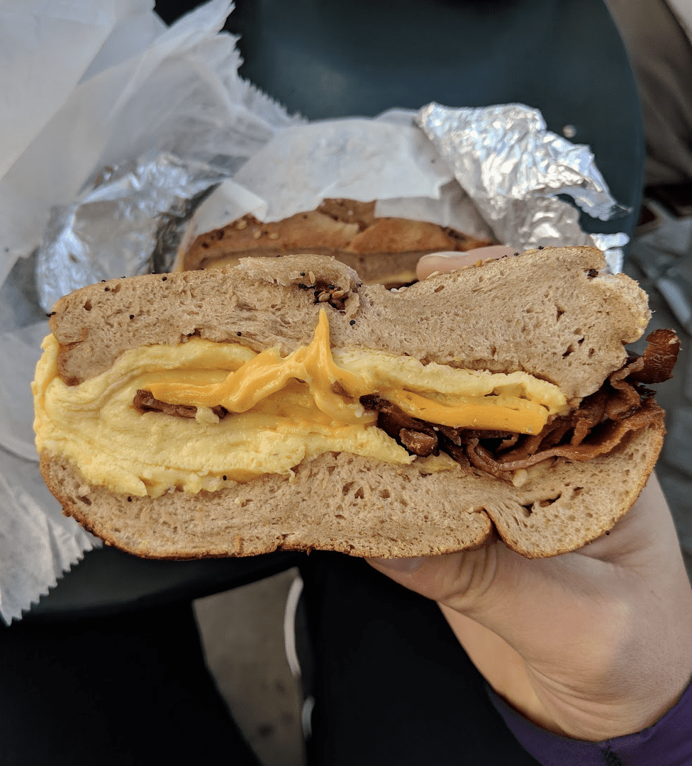 A bacon egg and cheese bagel from New York's Best Bagel and Coffee, one of the best cheap eats in Midtown, New York City