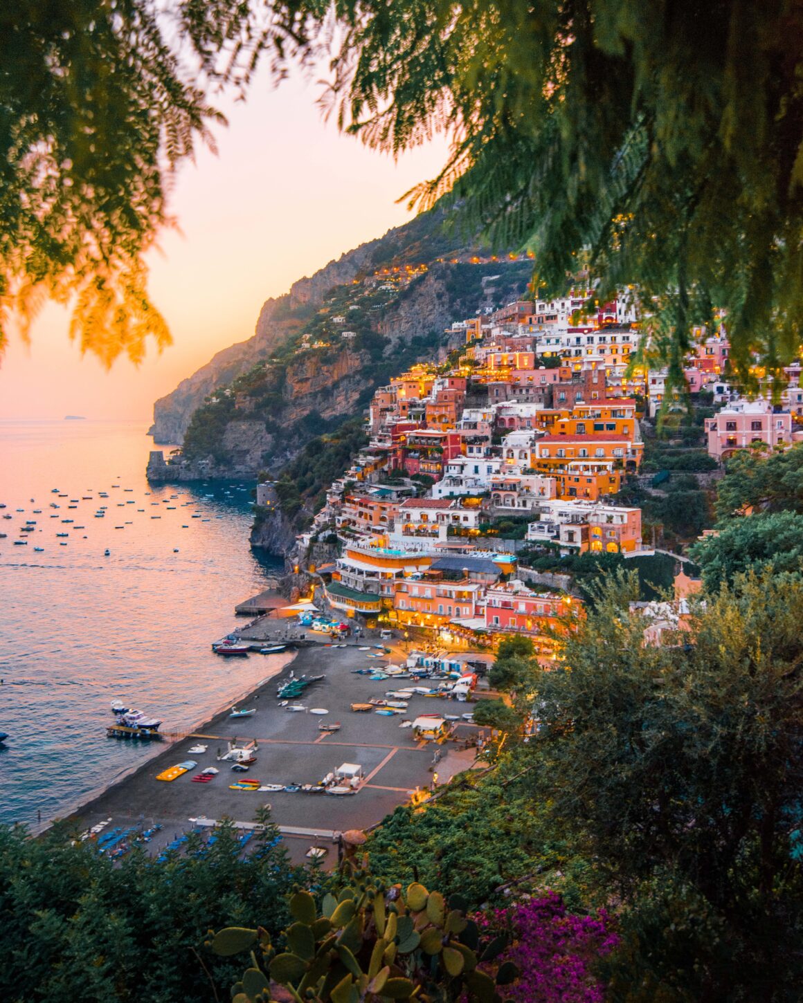 Positano at sunset, one of the best places to visit on the Amalfi Coast