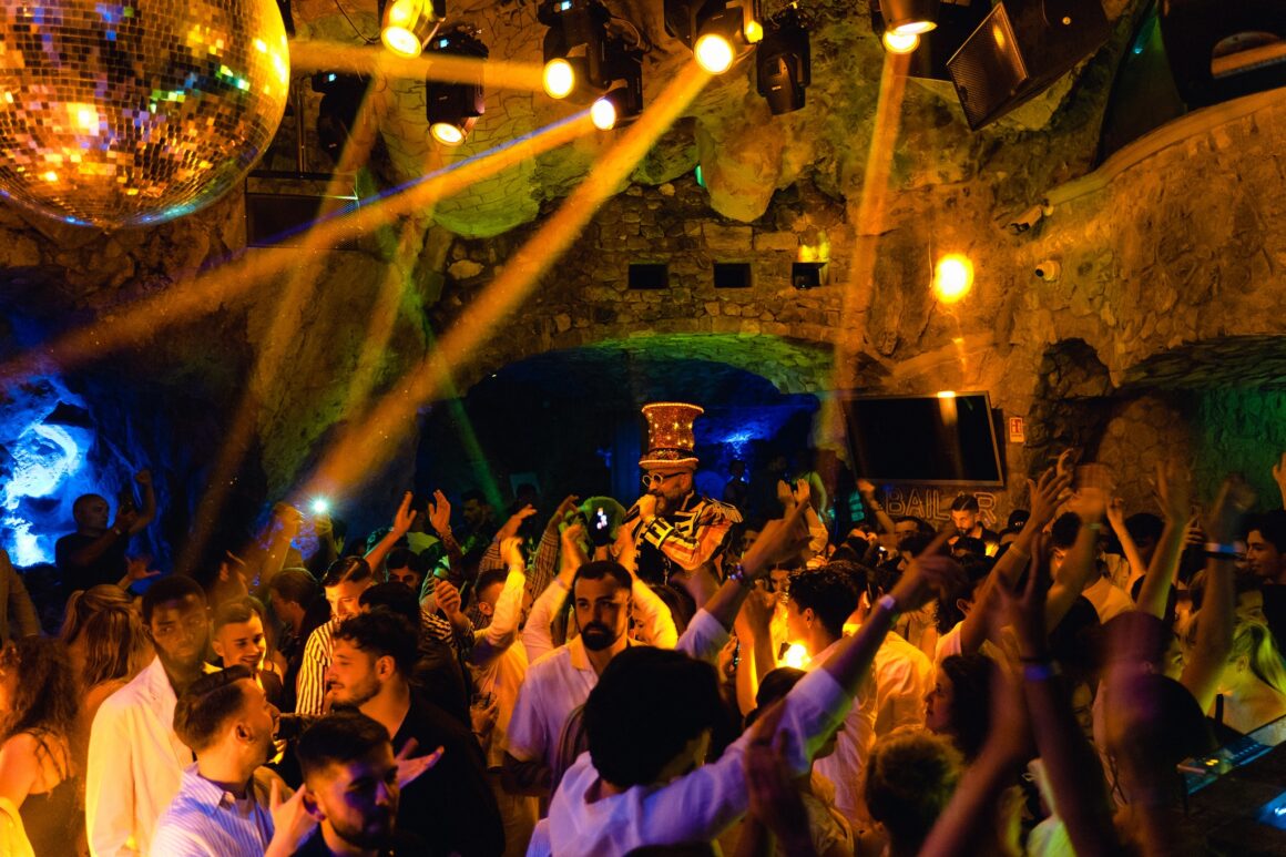 People dance at Music on the Rocks, a Positano nightclub, one of the best things to do in Positano