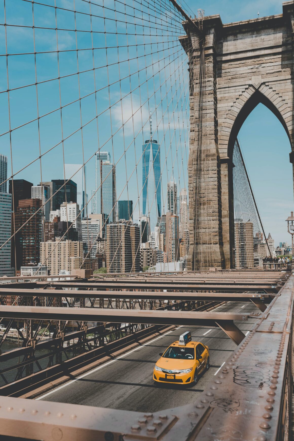 The Brooklyn Bridge with a view of Manhattan, one of the best free things to do in New York City.