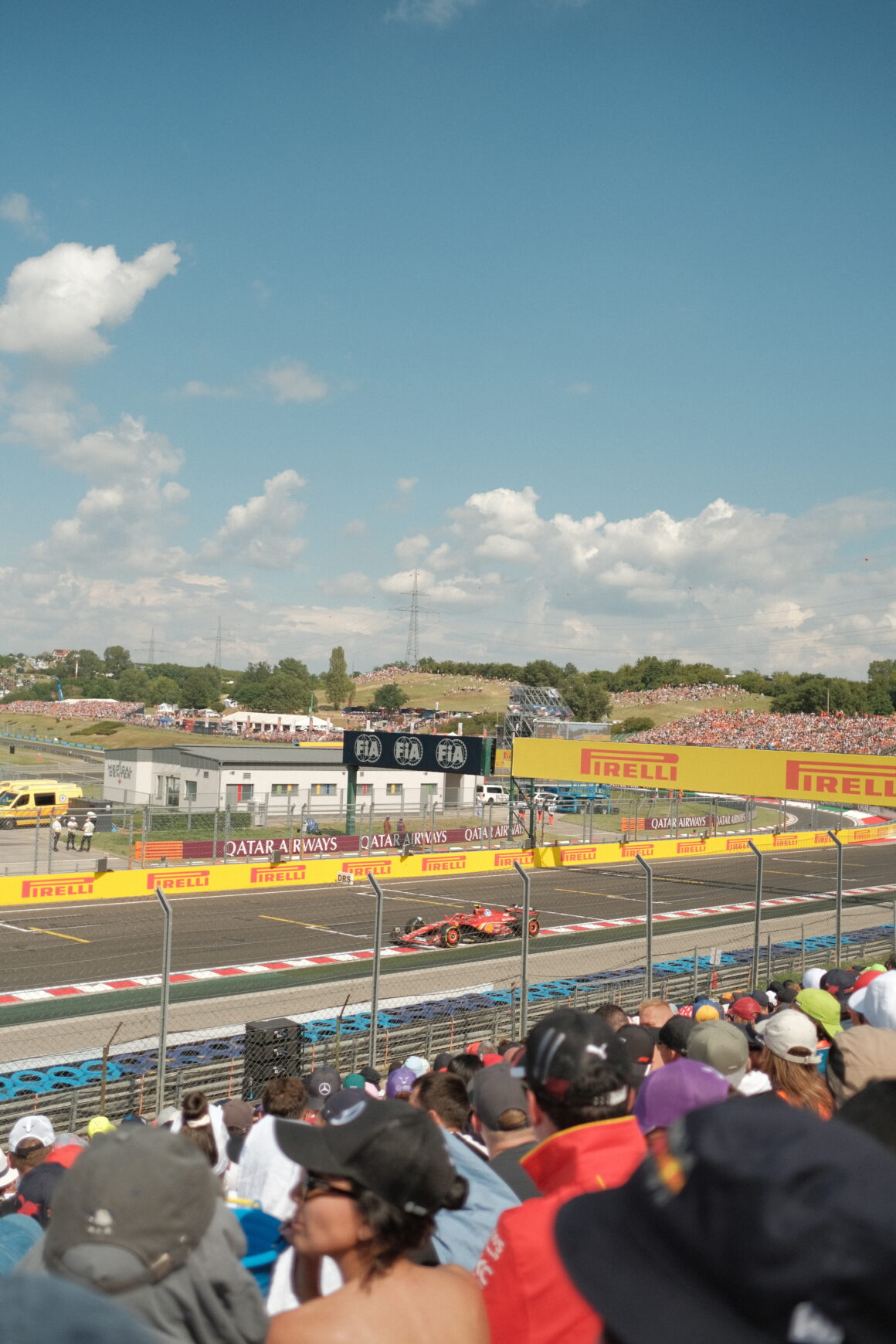 Fans cheer for Formula 1 cars as they race by in Hungary, one of the best parts about attending a Formula 1 race