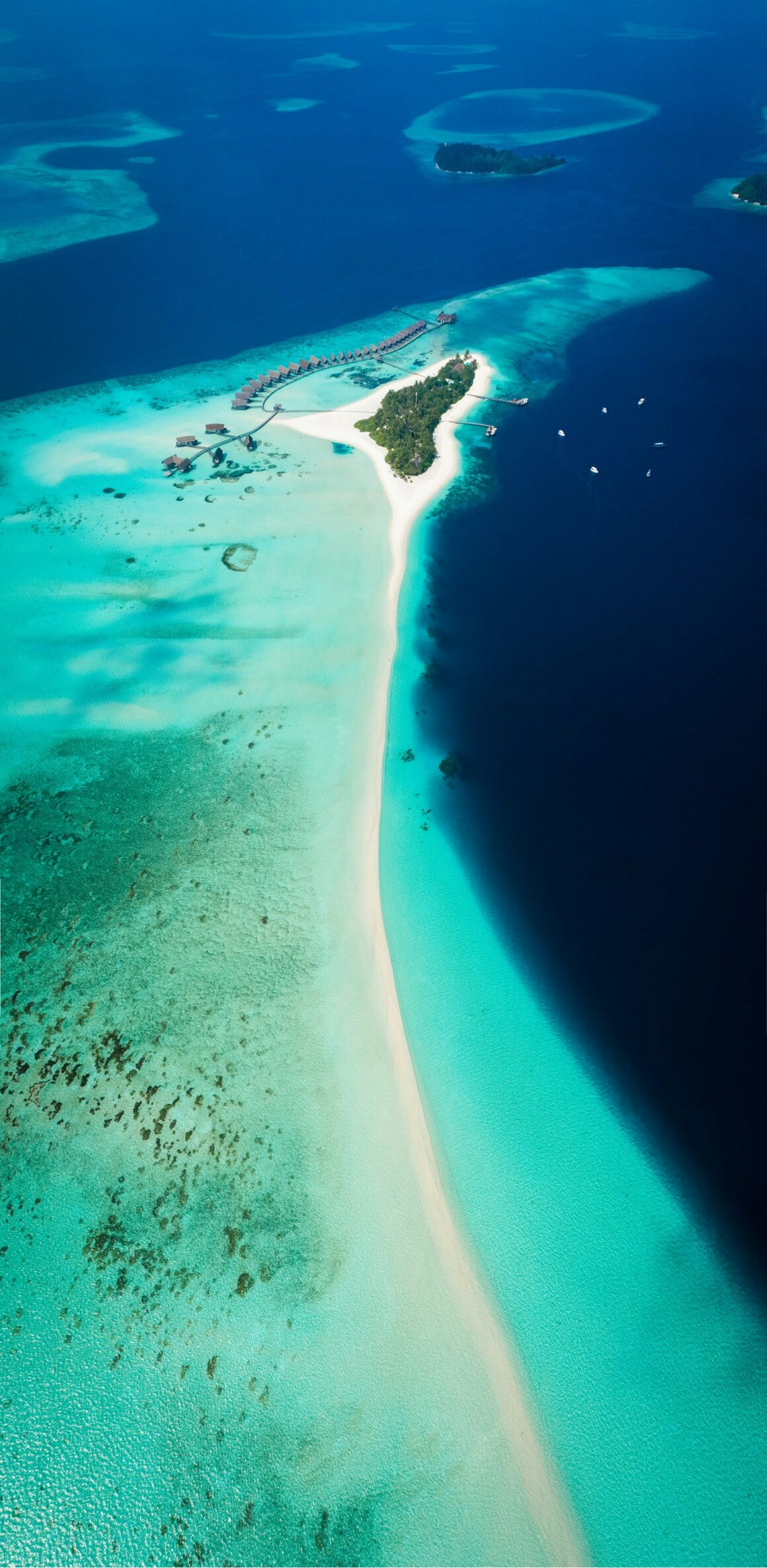 The beautiful blue waters of the Maldives islands, best visited during December to February, one of the best times to visit the Maldives