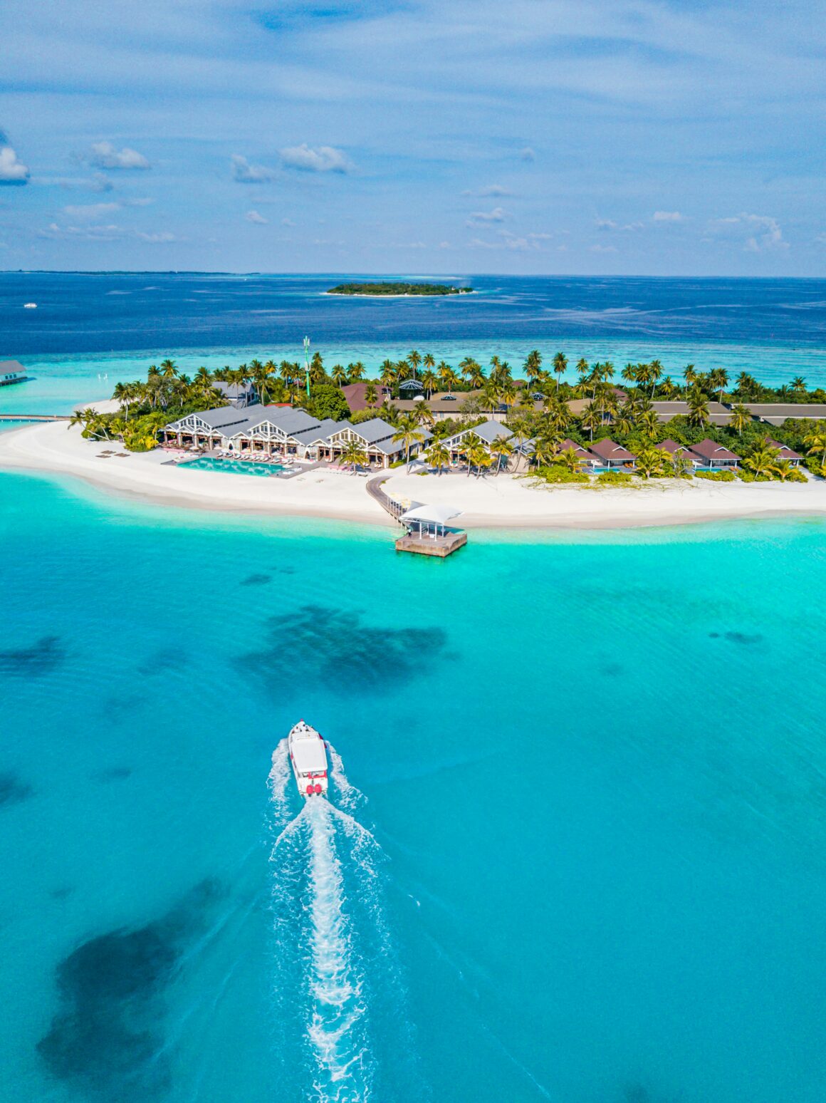 The beautiful blue waters of the Maldives islands, best visited during December to February, one of the best times to visit the Maldives