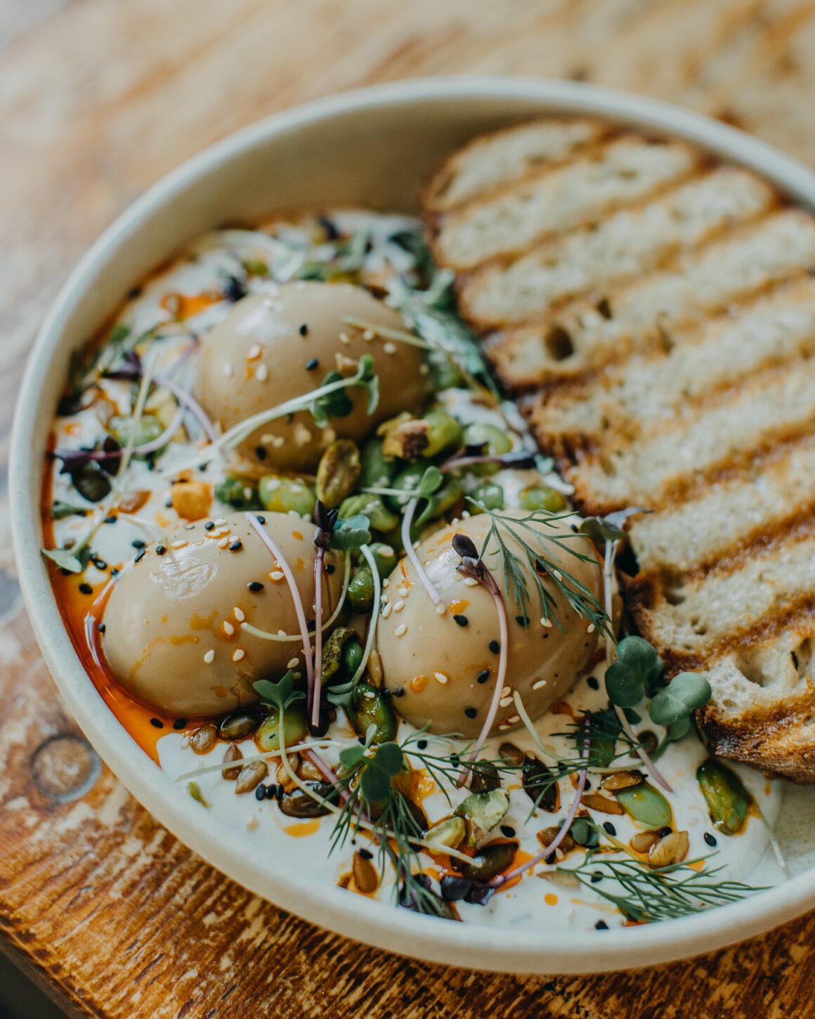 A bowl of potatoes, eggs and bread at Cafefin, one of the best brunch spots in Prague