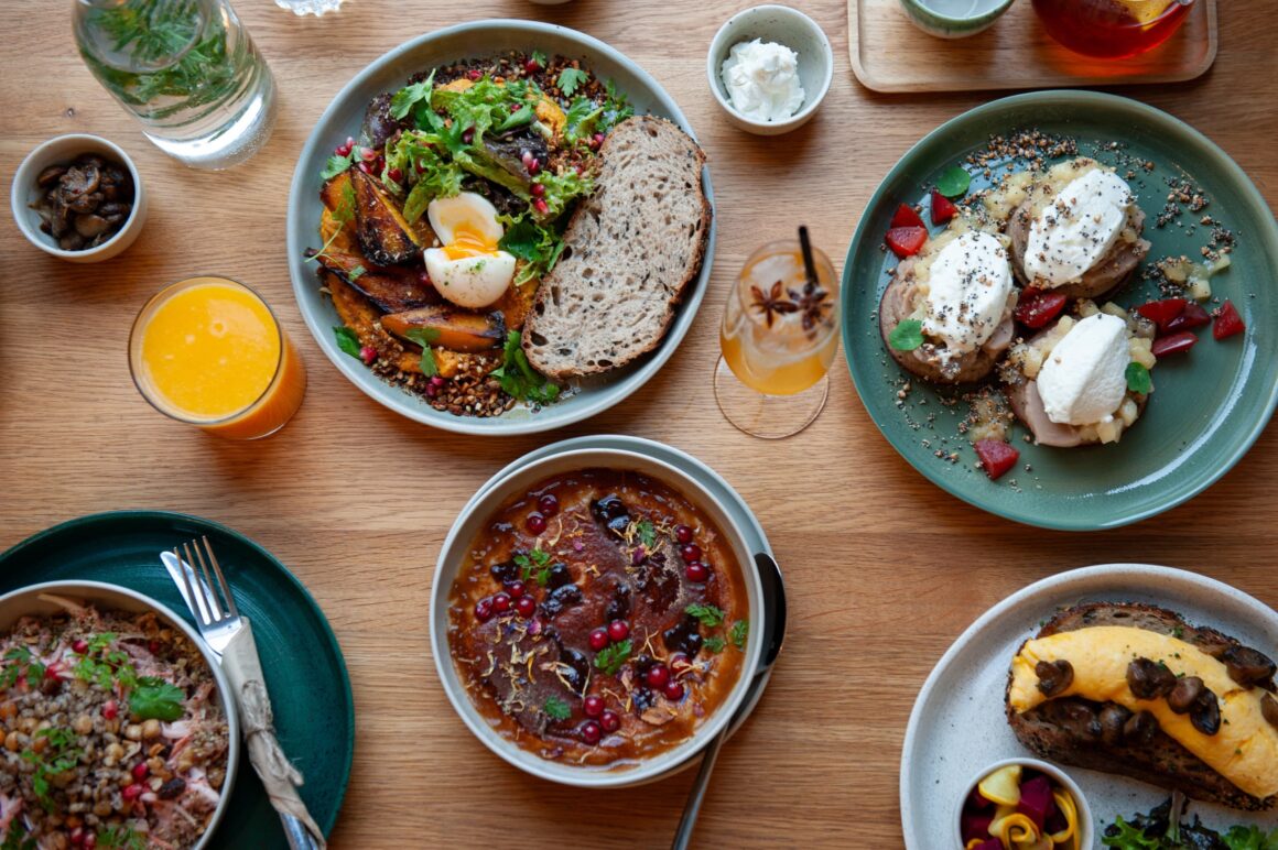 A table full of breakfast food at Mezi Srnky, one of the best brunch spots in Prague