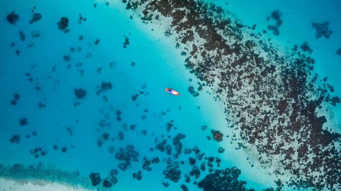 An aerial view of clear blue water in the Maldives