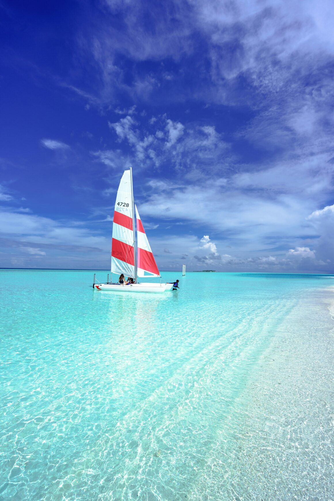 A boat rests on the water in the Maldives