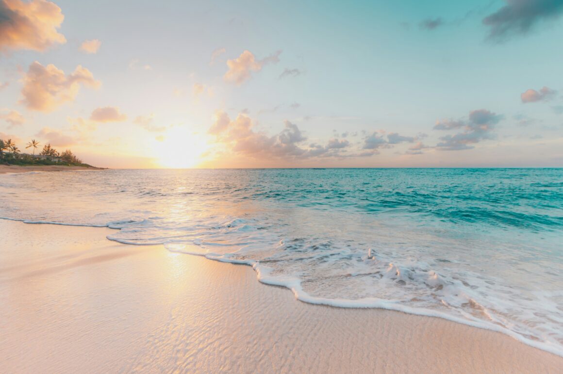 A sandy beach at sunset in the Maldives, taken during a budget trip to the Maldives