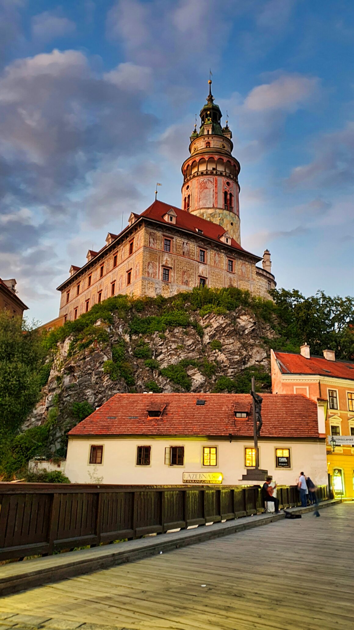 The castle towers above a bridge in Cesky Krumlov, one of the best places to visit in Czech Republic